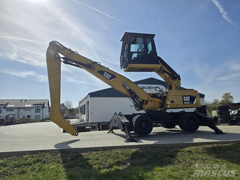 CAT 318D Materialumschlag