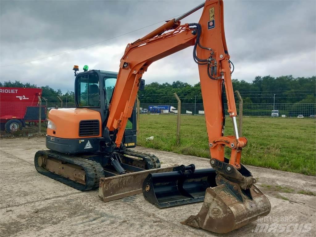 Develon DX63 Sonstige Landmaschinen